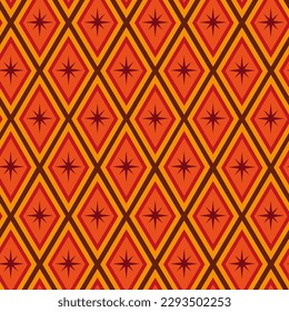 Mid century modern atomic starbursts seamless pattern  on retro diamond geometric shapes in orange, red, tangerine and brown. For backgrounds, fabric, textile , home decor and walllpaper 