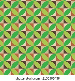 Mid century modern geometric leaves   seamless pattern in green over red, cream and brown squares. Great for wallpaper, home décor and textile 