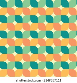 Mid century modern geometric leaves retro 70s seamless pattern in orange, apricot, pale green, emerald green over cream background. For home décor, textile, wallpaper and gift wrapping paper 