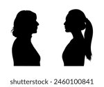 Middle aged woman and young woman facing each others side profile silhouette.	