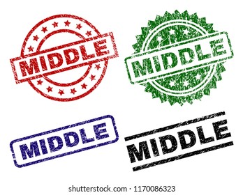 MIDDLE seal prints with damaged texture. Black, green,red,blue vector rubber prints of MIDDLE text with scratched texture. Rubber seals with circle, rectangle, medal shapes.