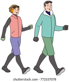 Middle-aged couple walking in winter clothes