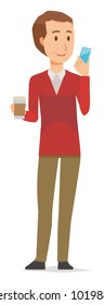 A middle-aged man wearing a sweater has coffee and manipulating a smartphone