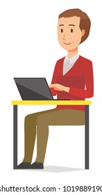 A middle-aged man wearing a sweater is operating a laptop computer