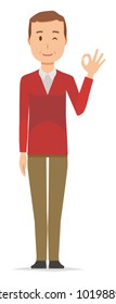 A middle-aged man wearing a sweater is playing an okay sign