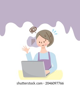 Middle-aged woman with a troubled face using a computer