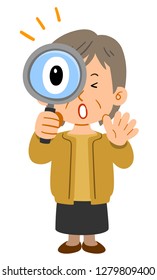 Middle-aged women senior who is amazed at peering into the magnifying glass
