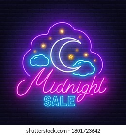 Midnight sale neon sign on a brick wall background.