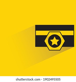 military insignia with shadow on yellow background
