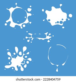 Milk blots set. White smudges splashes drops on blue background. Organic natural farm fresh milk labels vector collection. Splash and blot design shape creative illustration. Milk splat set. Milk drop