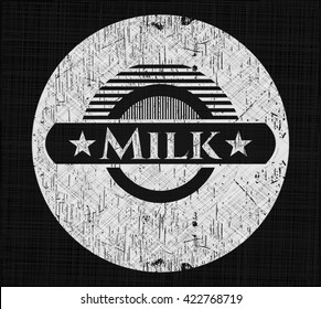 Milk chalk emblem written on a blackboard