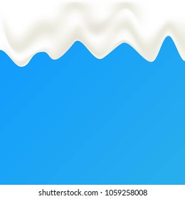 milk drips on blue background