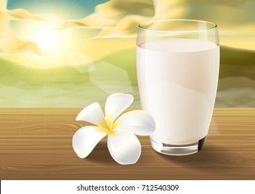 milk and plumeria on wooden table on the morning