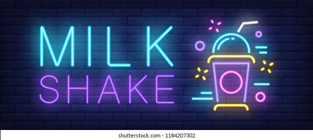 Milk shake neon sign. Colorful takeaway cup with cap and straw on brick wall background. Vector illustration in neon style for ice cream shop children party and cafe