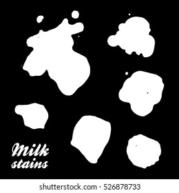 Milk stains - set of silhouettes. Isolated on black background. Vector. Eps 10