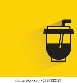 milk tea cup with shadow on yellow background