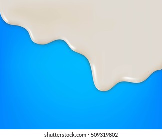 Milk, yogurt or cream dripping on blue background