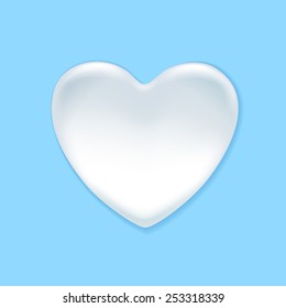 Milk, yogurt or cream splash shaped in heart form. White blotch.