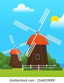 Mill construction, meadow with grass and greenery warm season. Countryside with windmill, village architecture. Mill for production of natural food. Farmyard, ecological farm landscape in spring