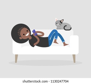 Millennial character lying on a sofa and checking the smartphone. Social networks and apps. Flat editable vector illustration, clip art. Modern lifestyle. Communication technologies.