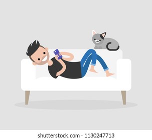 Millennial character lying on a sofa and checking the smartphone. Social networks and apps. Flat editable vector illustration, clip art. Modern lifestyle. Communication technologies.