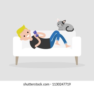 Millennial character lying on a sofa and checking the smartphone. Social networks and apps. Flat editable vector illustration, clip art. Modern lifestyle. Communication technologies.