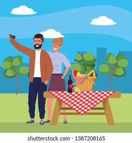 Millennial couple smartphone taking selfie picnic background