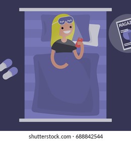 Millennial female character using a smartphone in bed / flat editable vector illustration, clip art