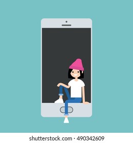 Millennial girl sitting inside the smart phone concept / Editable flat vector illustration
