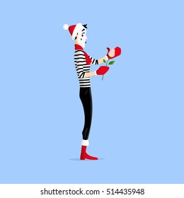 A Mime performing a pantomime called keeping a flower warm