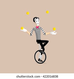 A Mime performing a pantomime - the juggler on the mono cycle