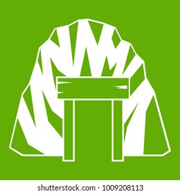 Mine in mountain icon white isolated on green background. Vector illustration