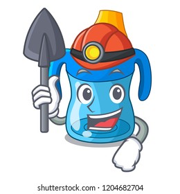Miner cartoon baby drinking from training cup