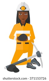 Miner holding coal in hands.