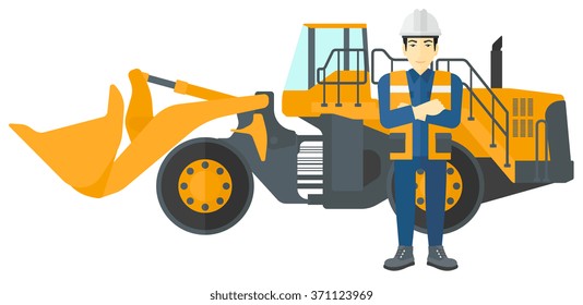 Miner with mining equipment on background.