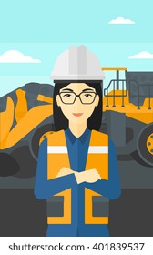 Miner with mining equipment on background.