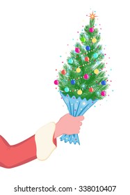 Mini Christmas tree in the hand of Santa Claus on white background