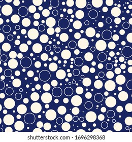 Mini circle seamless pattern. Geometric surface print. Repeated irregular polka dot, bubble motif ornament. Geo dotted ornamental background. Modern minimal design texture. Vector abstract wallpaper