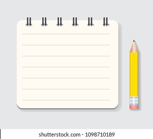 mini notebook and yellow pencil