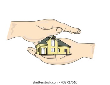 miniature house in hands