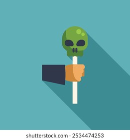 Minimal illustration of a hand holding a green skull lollipop on a stick, halloween concept