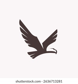 A minimal logo featuring a silhouette of an eagle flying.