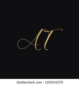 Minimal luxurious elegant AT TA A T artistic black and golden color initial based letter icon logo.