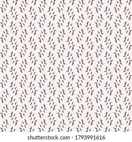 Minimal pattern with traces of spikes on a light pink pattern. Wallpaper texture. Textile design.