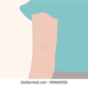 Minimal Tiny heart tattoo on a girl's arm in pastel color. Celebrating Valentine's Day.