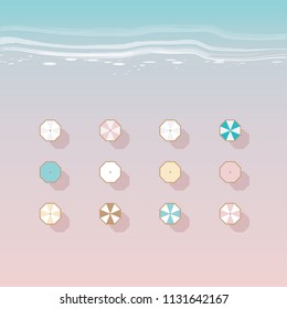 Minimal vector illustration of colorful beach umbrellas on a sand viewed from top perspective