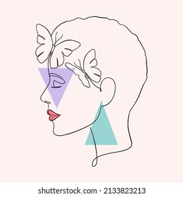 Minimal woman face with butterflies. Creative illustration in line art style.