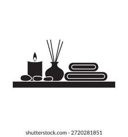 Um arranjo minimalista de um difusor de vela e toalhas enroladas em uma prateleira