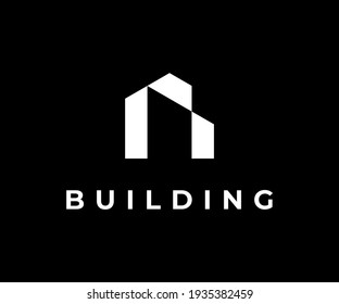Minimalist creative building geometric logo icon design modern style illustration. simple house vector symbol