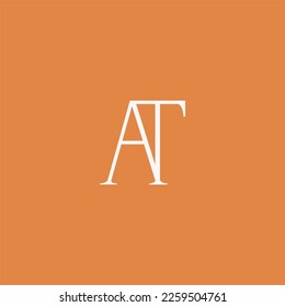 Minimalist and elegant AT letter with Serif style logo design vector. perfect for fashion, cosmetic, branding, and creative studio